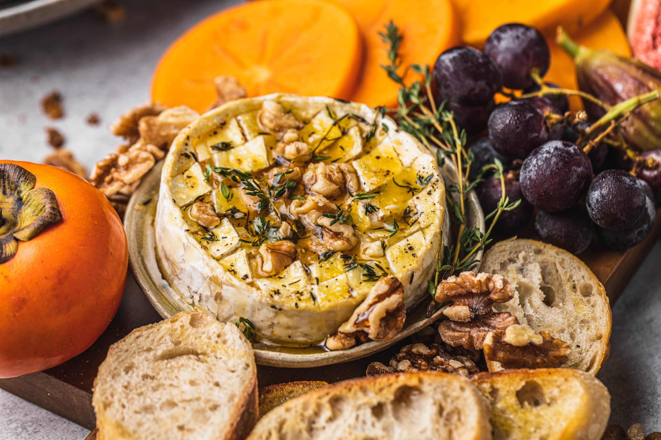 Persimmon & Thyme Baked Brie Crostinis